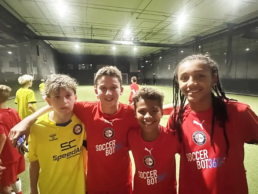 Youth soccer players training with the SoccerBot360 system at Soccer Field Academy in Columbus, Ohio